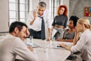 Manager addressing conflict within his team to boost team spirit