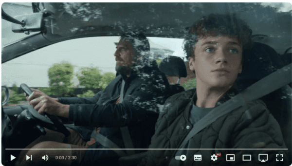 Screenshot from the Tesco Christmas advert with Dad and son in the car