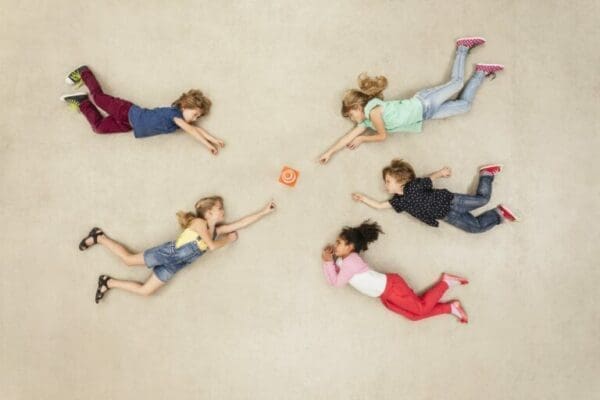 Children reaching for new mini gadget Children reaching for new mini gadget they want and need during Consultative Selling