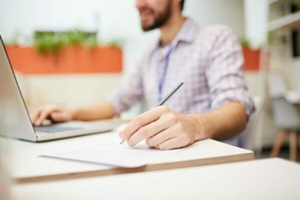 Man taking notes on notepad
