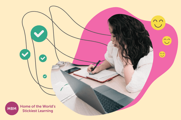 Female hard worker person writing notes at her desk while on the phone