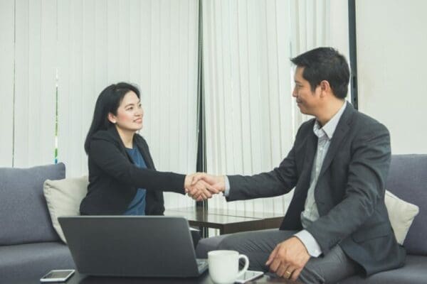 businesspeople shaking hands after a negotiation