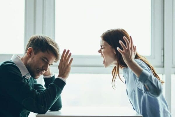 Woman yelling at man during conflict escalation