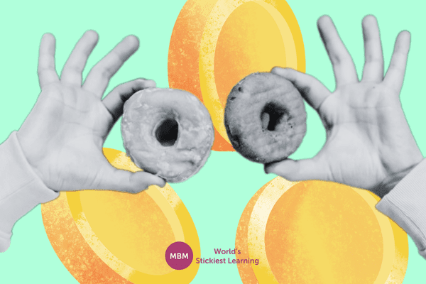 Hand comparing two donuts with coin background