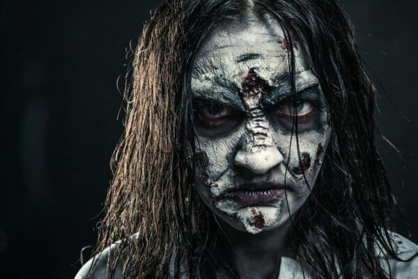 Zombie female leader with bloody face