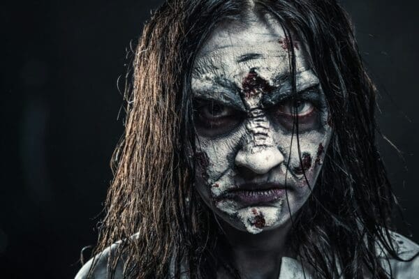 Zombie female leader with bloody face