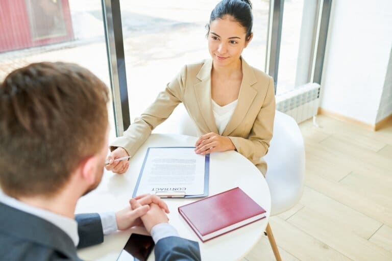 Female Business Manager negotiating with a client after soft skills training course